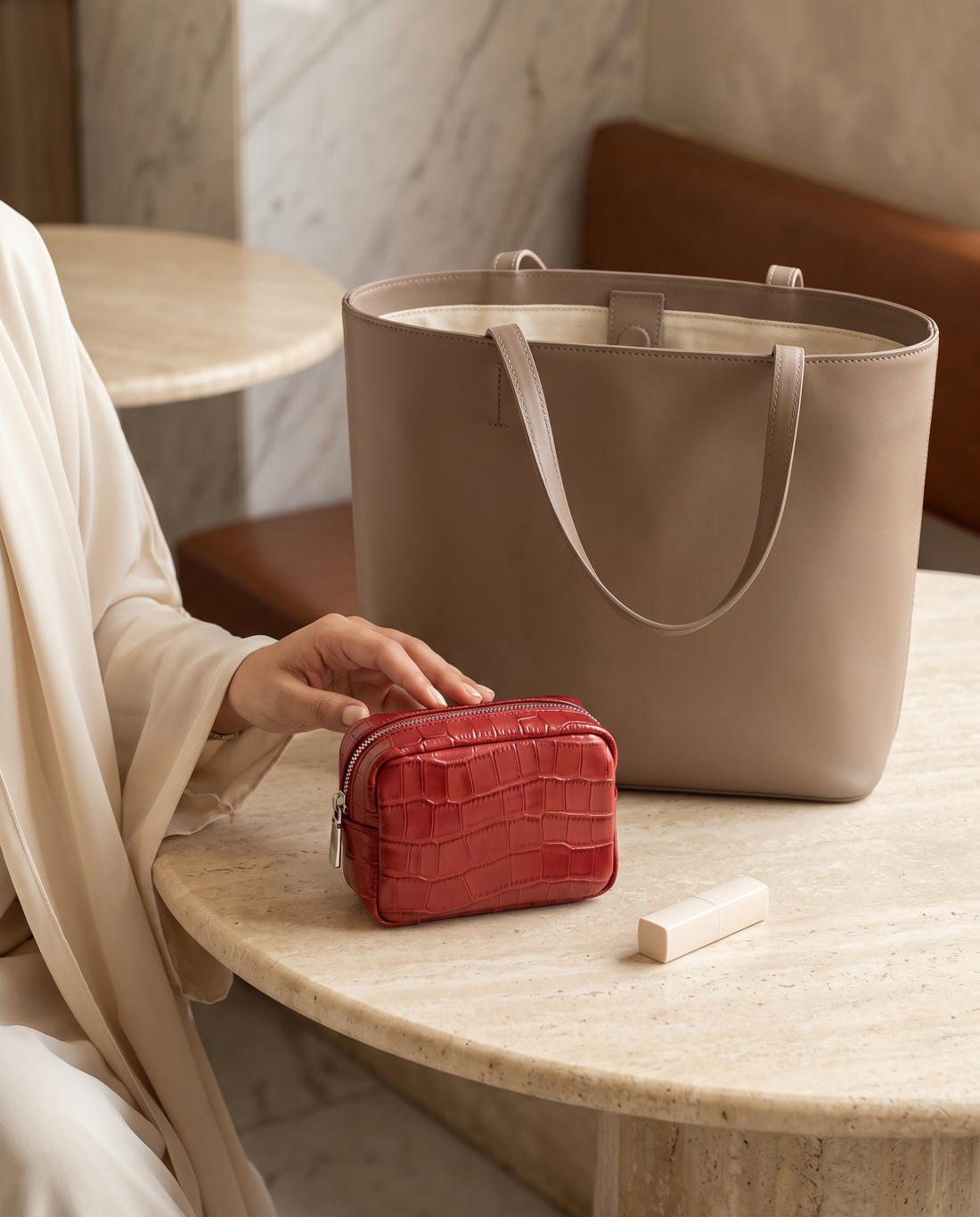 Lip Essential in Red — beside a handbag
