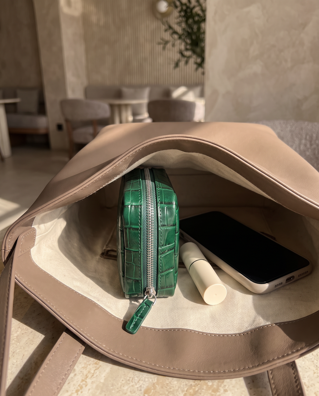 Lip Essential in Emerald — inside a handbag