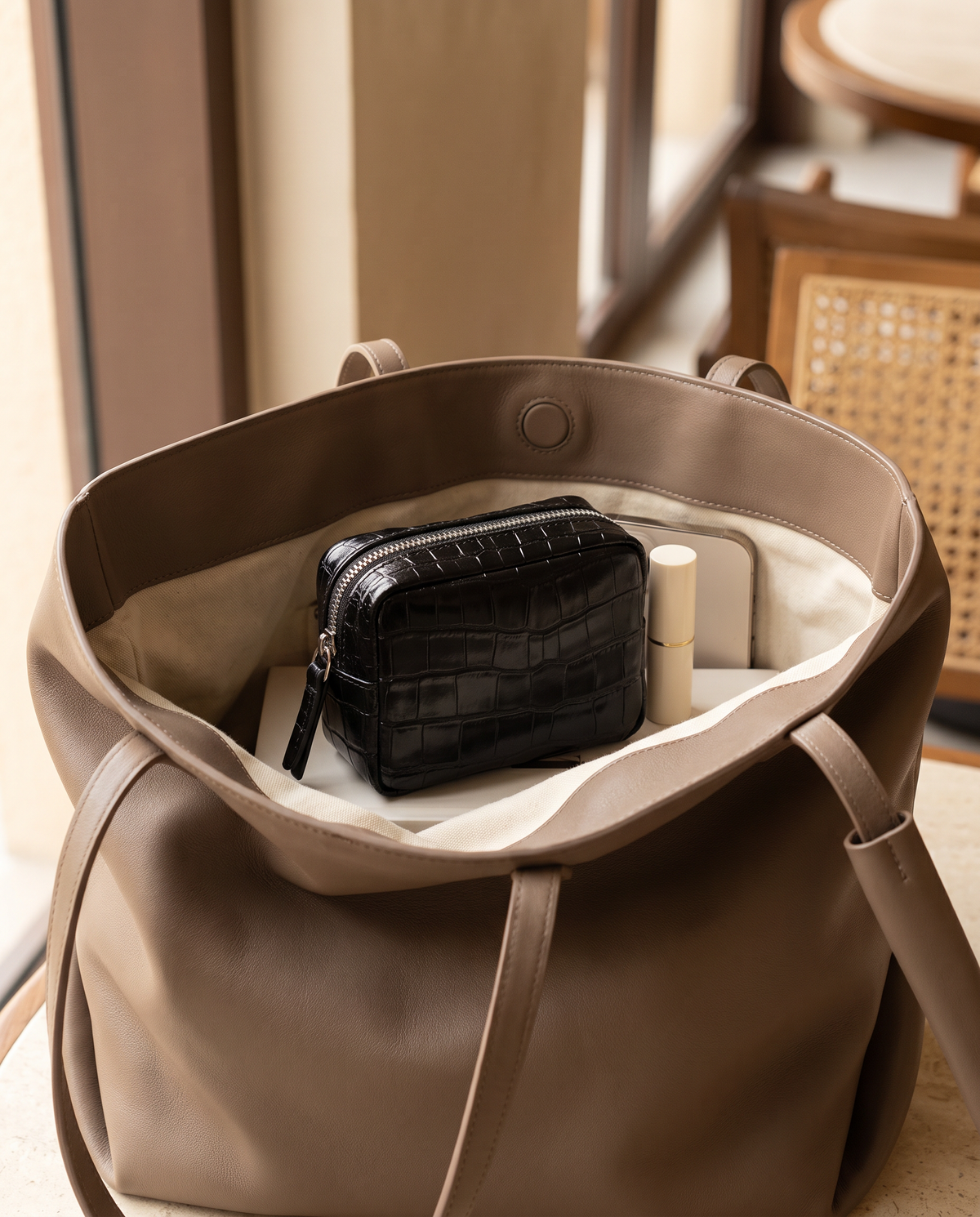 Lip Essential in Black — inside a handbag
