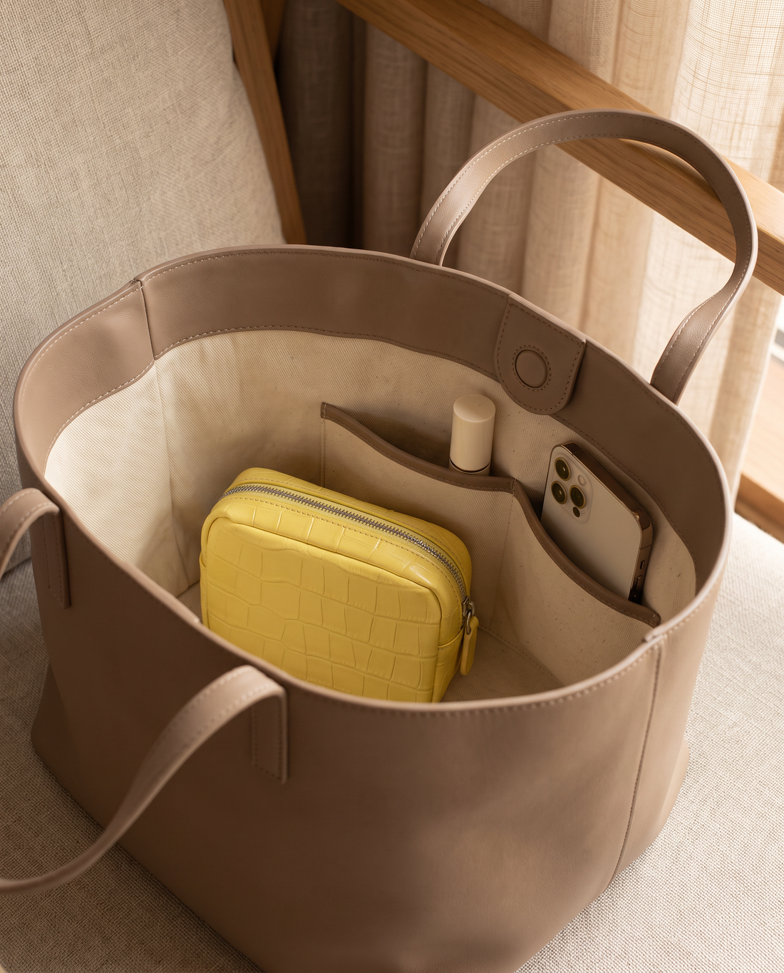 Lip Essential in Yellow — inside a handbag