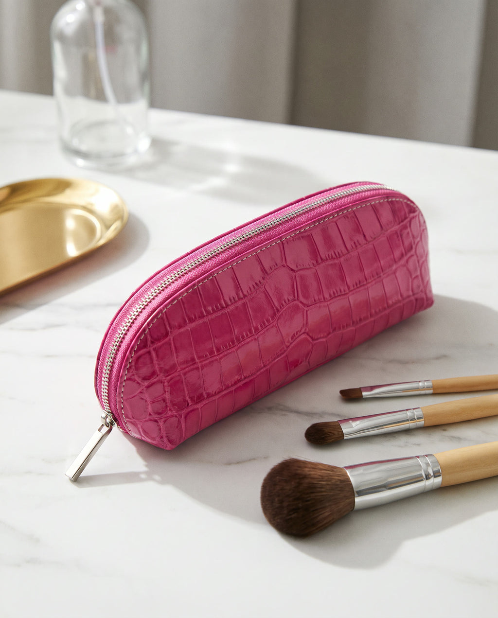The Amira Brush Case — Fuchsia — on the dressing table [v2]
