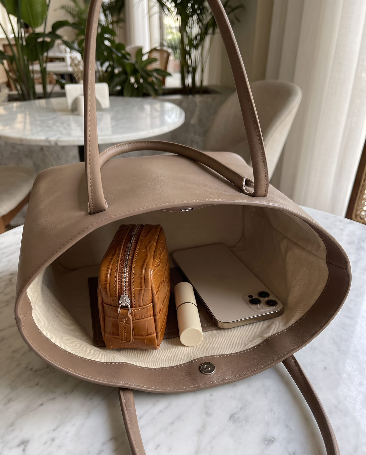 Lip Essential in Caramel — inside a handbag