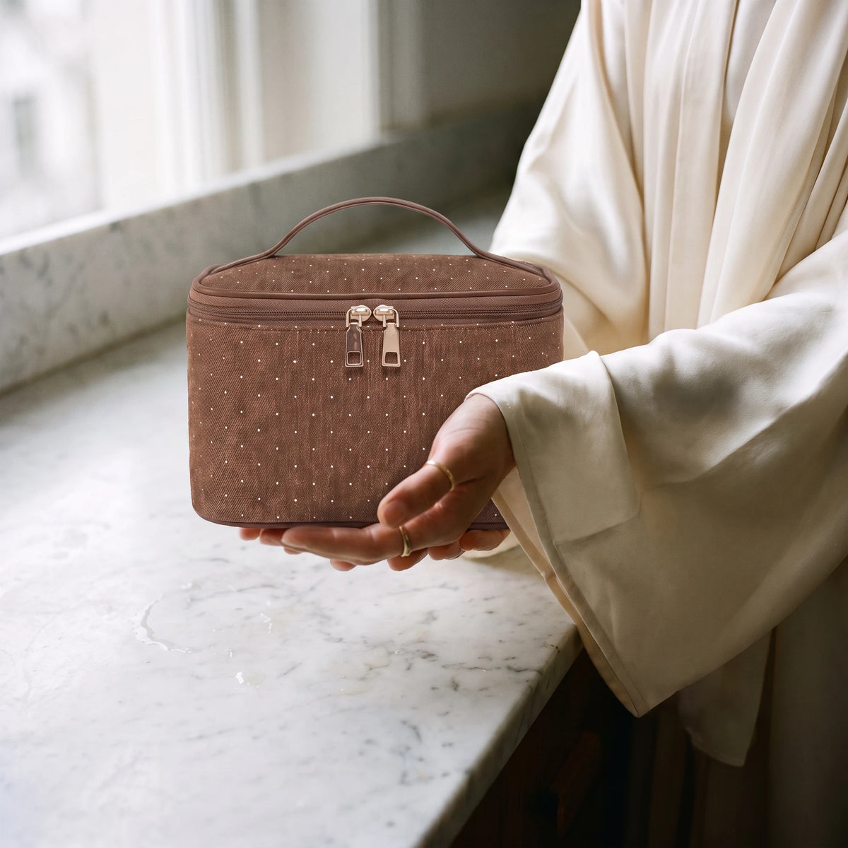 oxford-toiletry-bag-brown in hands