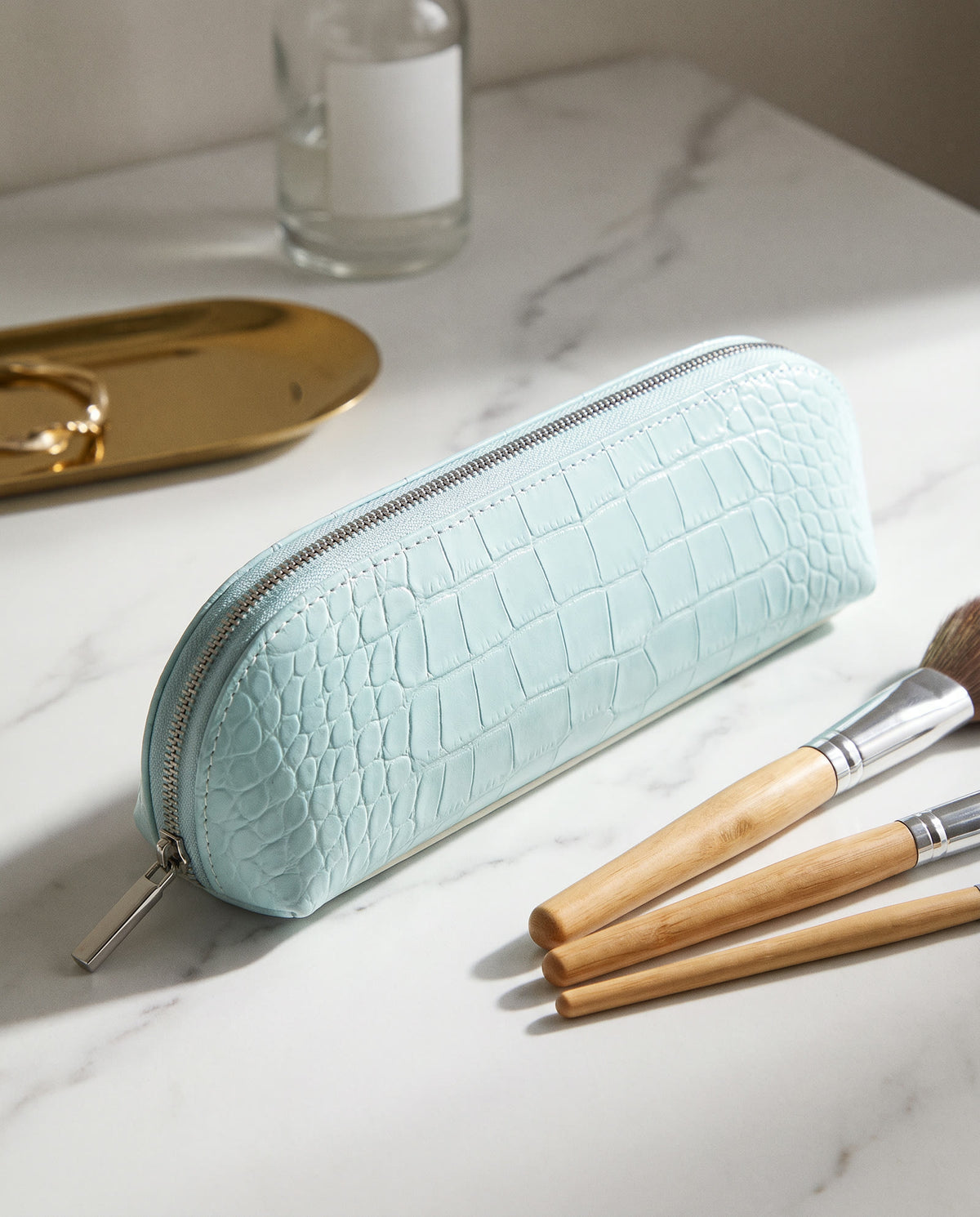 The Amira Brush Case — Aqua — on the dressing table [v2]