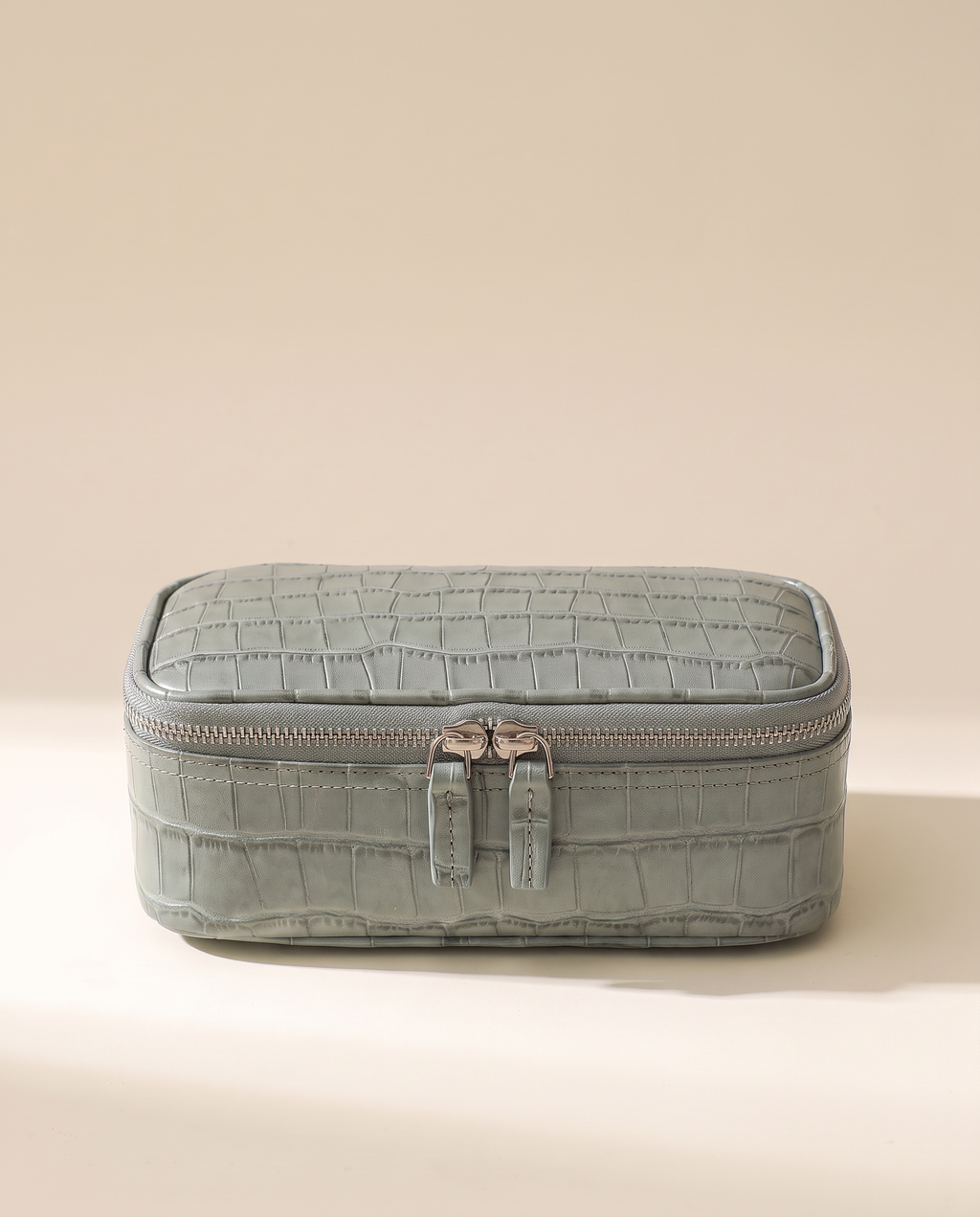 The Amira Pouch — Sage Grey, front view · Elirati · 2026-10b