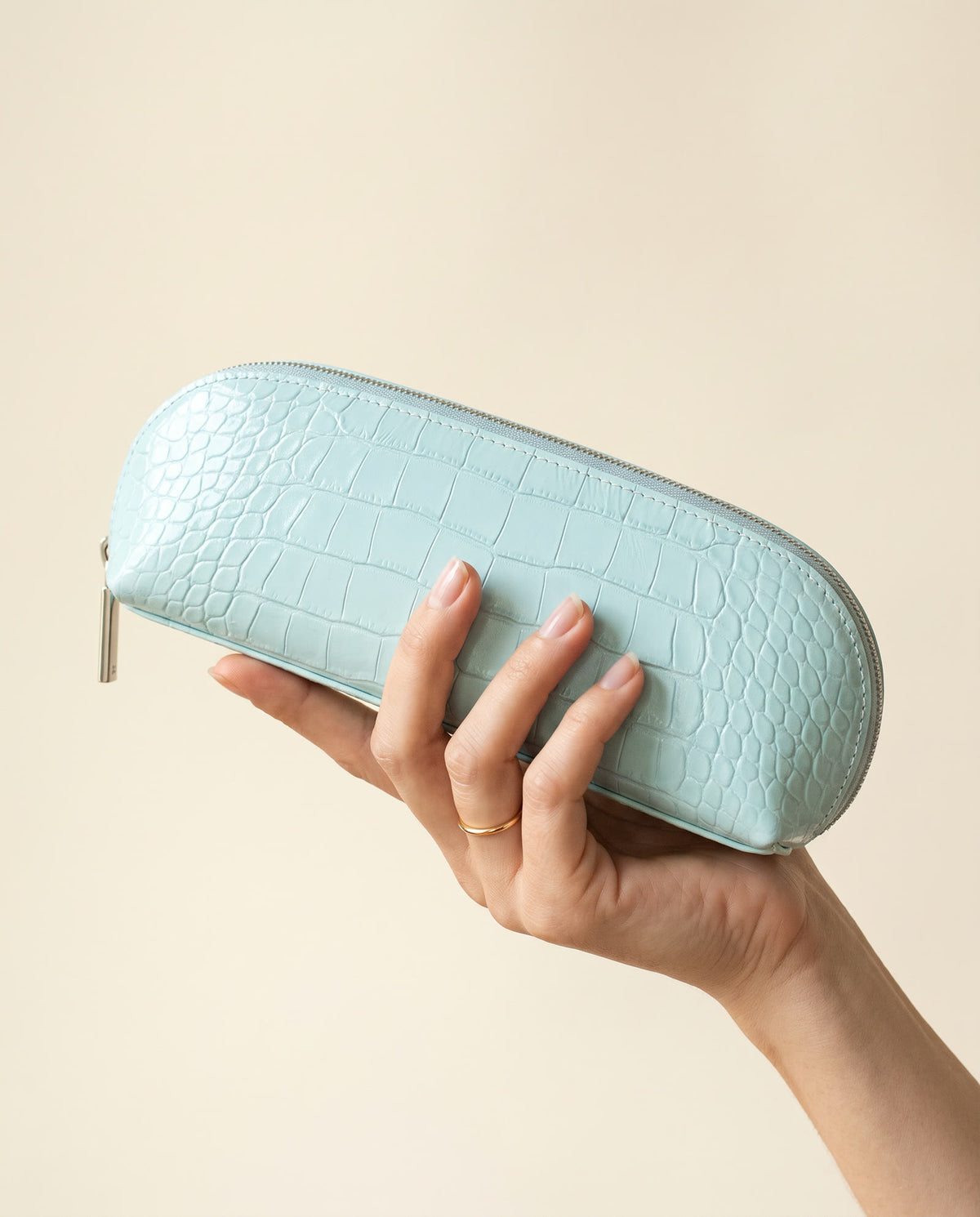 The Amira Brush Case — Aqua — in hand [v2]