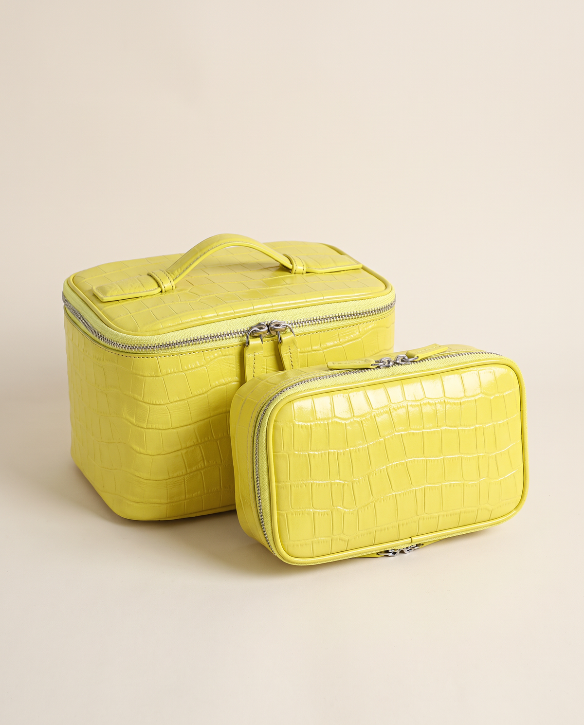 The Amira Pouch — Butter, with its matching pouch · Elirati