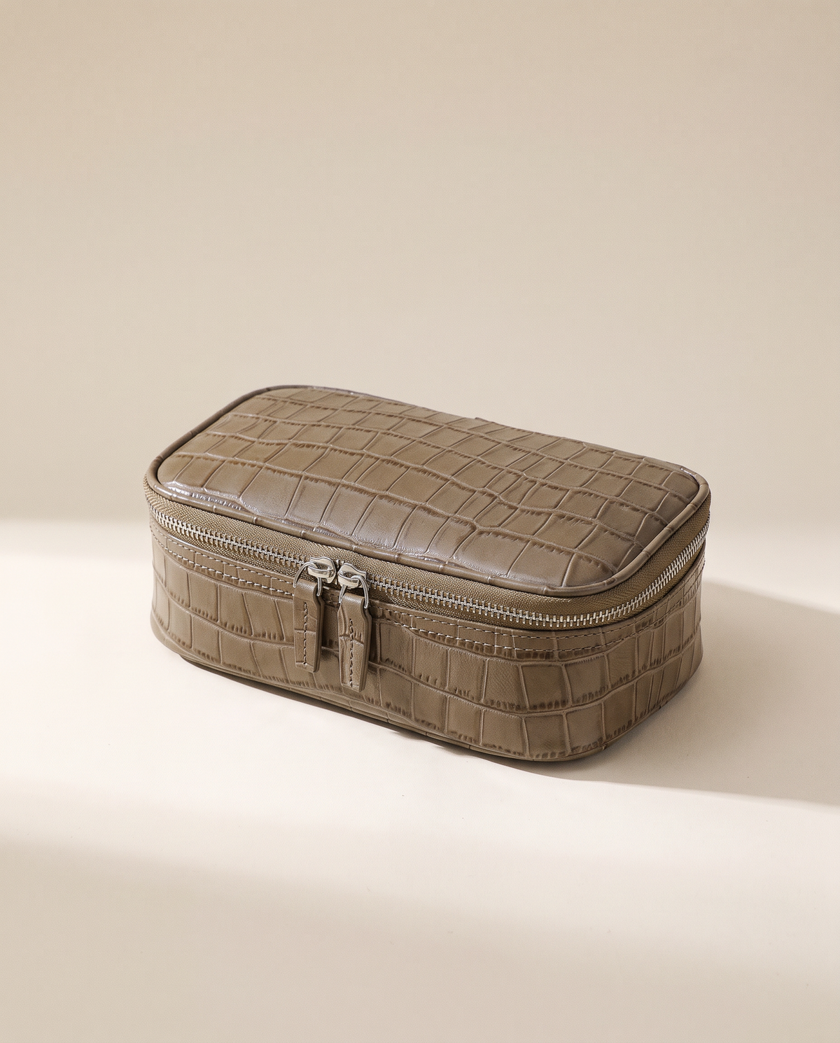 The Amira Pouch — Elephant Grey, three-quarter view · Elirati