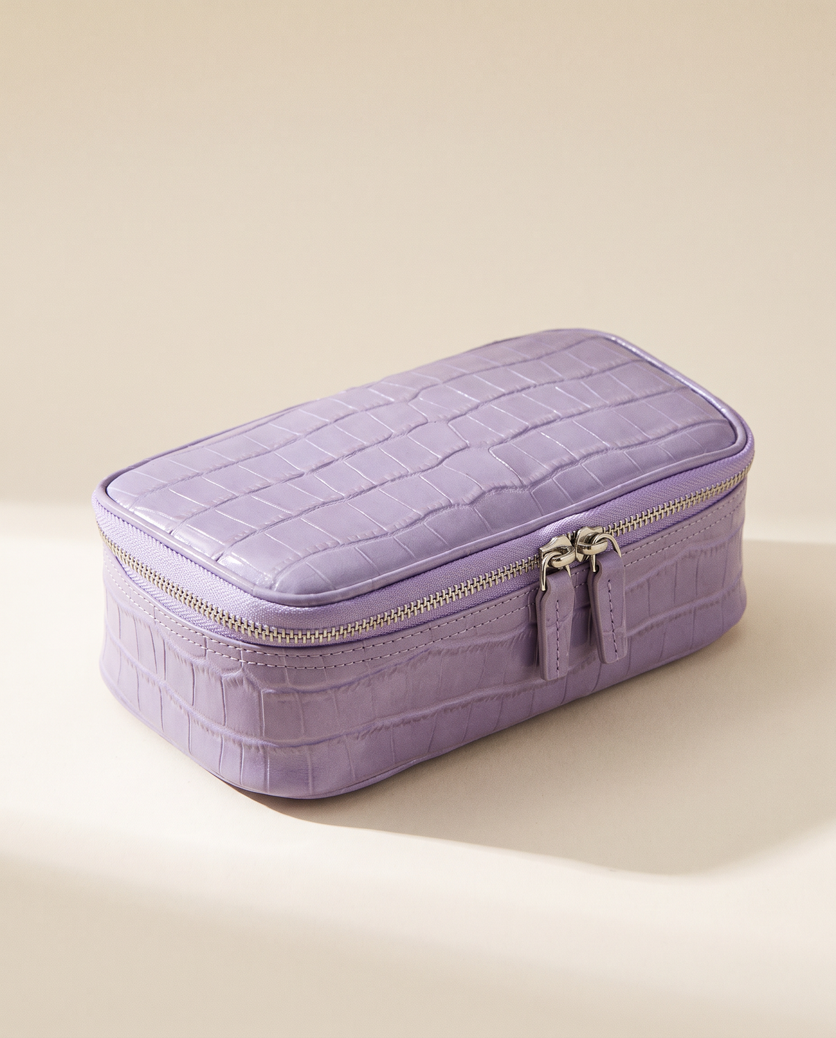 The Amira Pouch — Lavender, three-quarter view · Elirati
