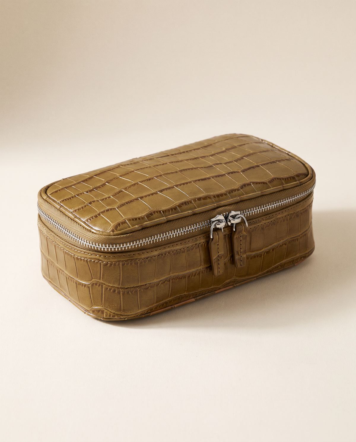 The Amira Pouch — Ochre, three-quarter view · Elirati