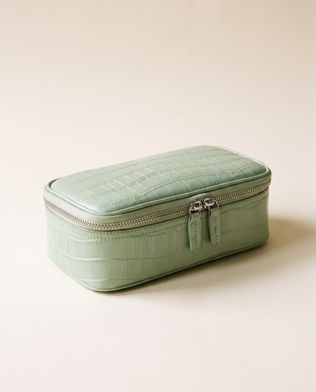 The Amira Pouch — Pistachio, three-quarter view · Elirati