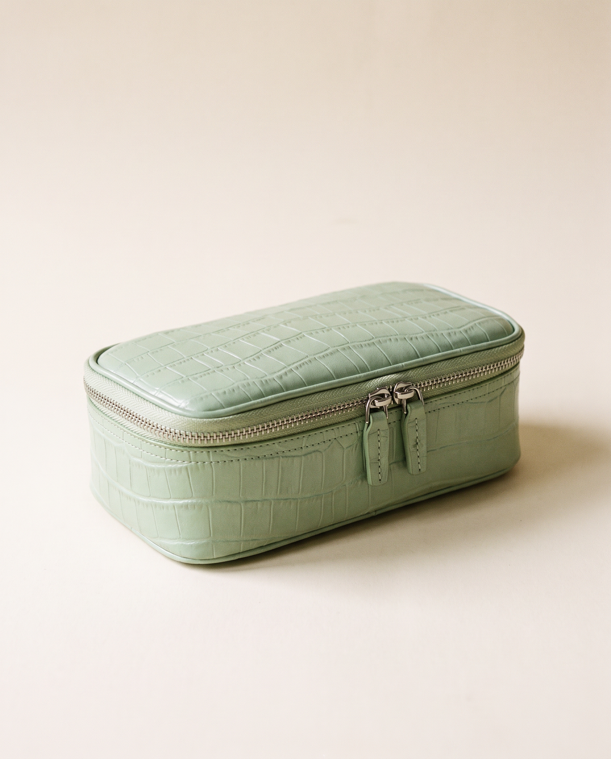The Amira Pouch — Pistachio, three-quarter view · Elirati