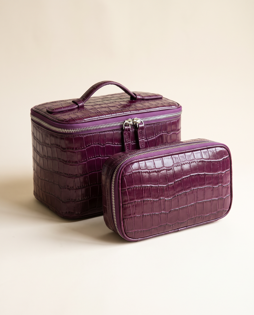 The Amira Pouch — Plum, with its matching pouch · Elirati