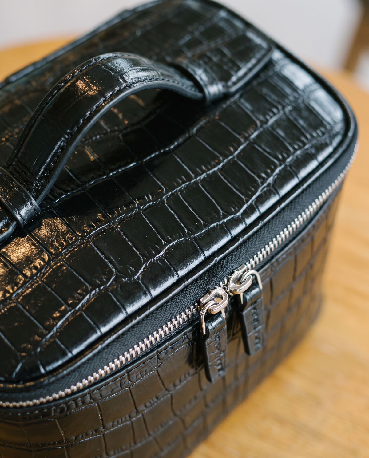 The Amira Vanity — Black, texture and zip detail · Elirati
