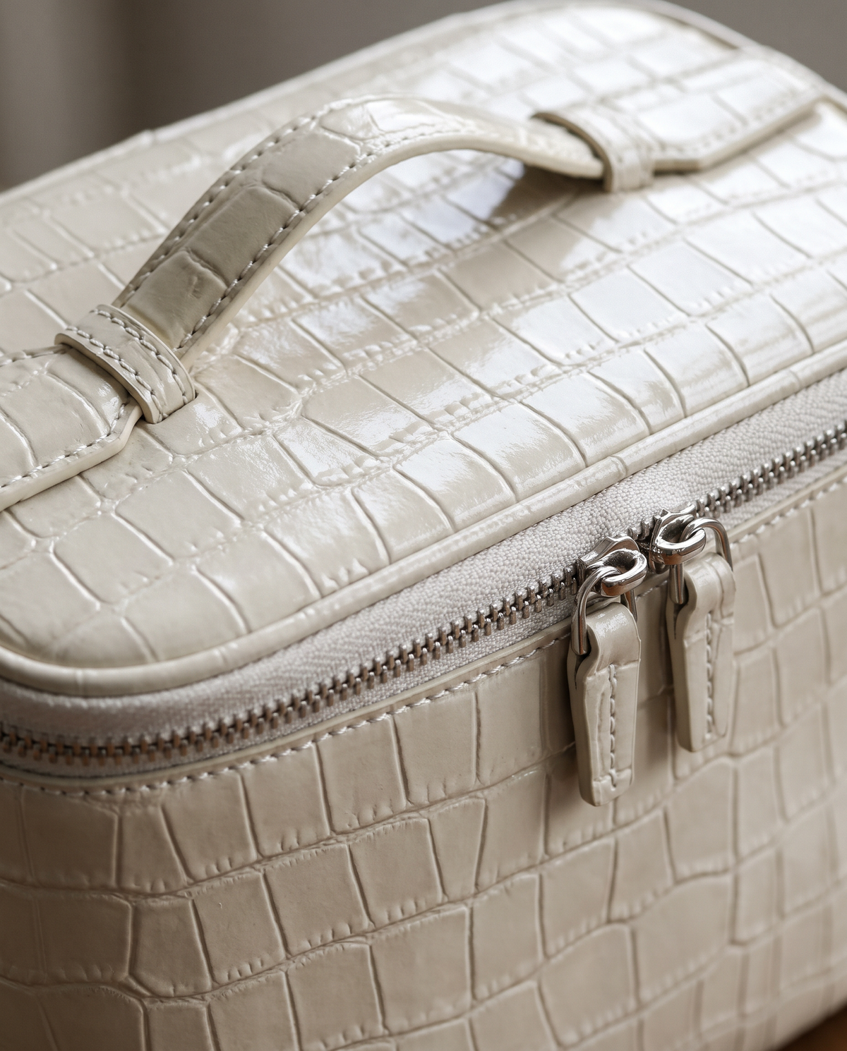 The Amira Vanity — Pearl White, texture and zip detail · Elirati