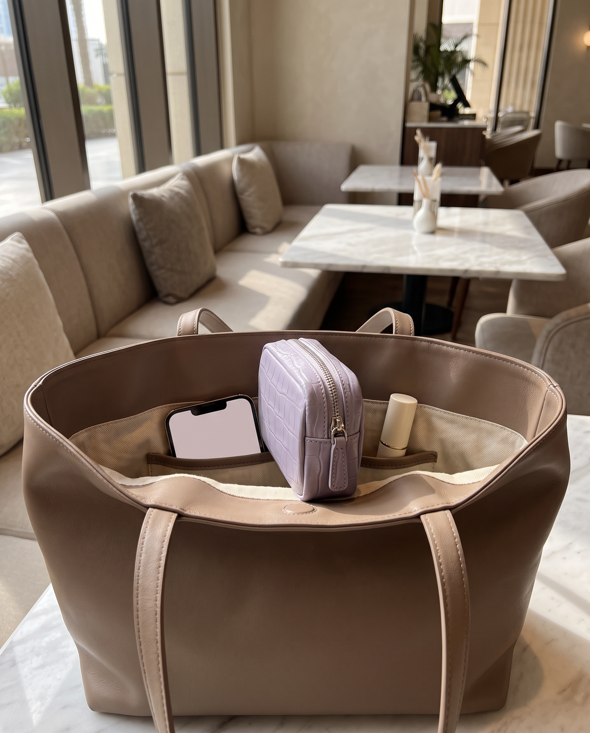 Lip Essential in Lavender — inside a handbag