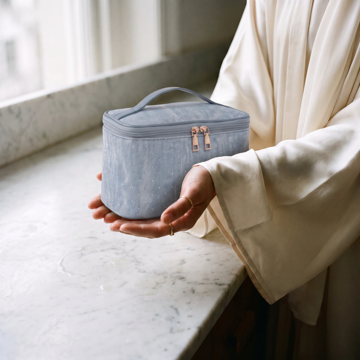 oxford-toiletry-bag-blue in hands
