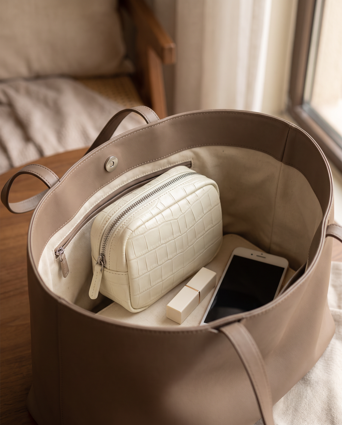 Lip Essential in Ivory — inside a handbag