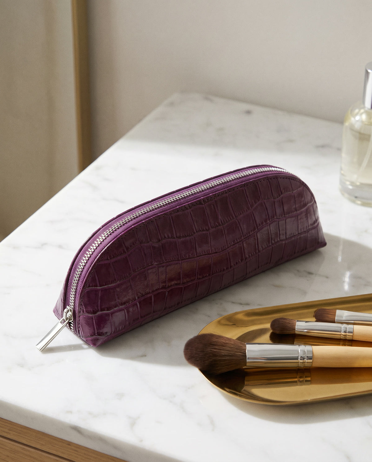 The Amira Brush Case — Plum — on the dressing table [v2]